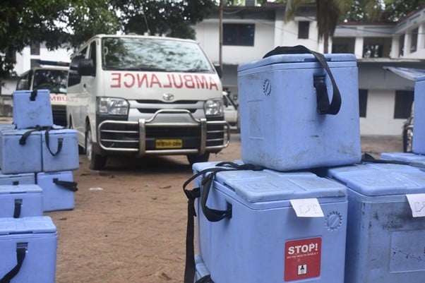 Cool boxes filled with the Johnson & Johnson vaccine await delivery at a distribution centre
